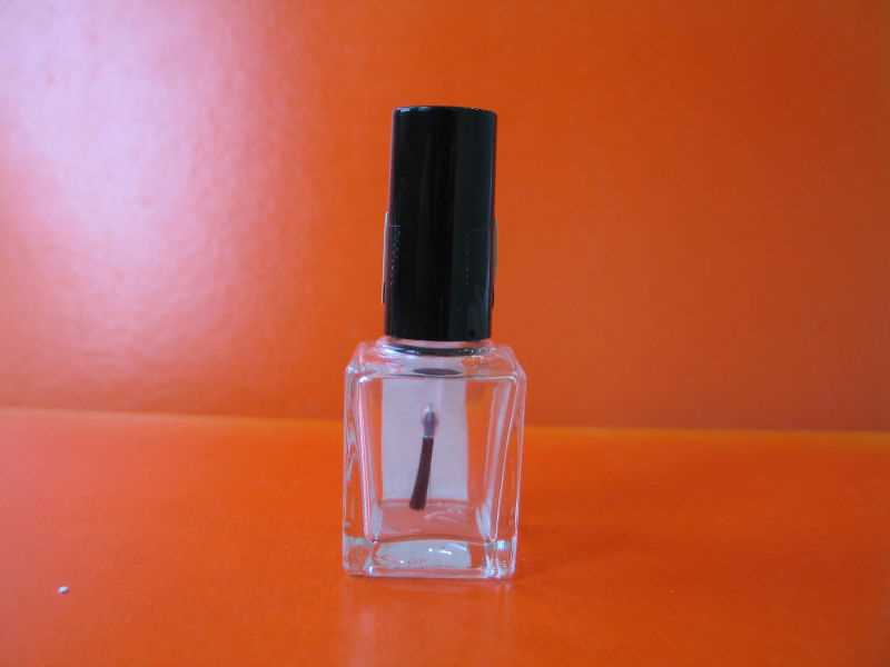 Nail polish cap with brush and bottle
