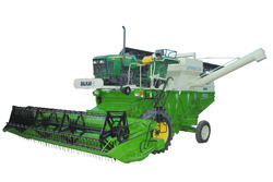 Tractor mounted combine harvester